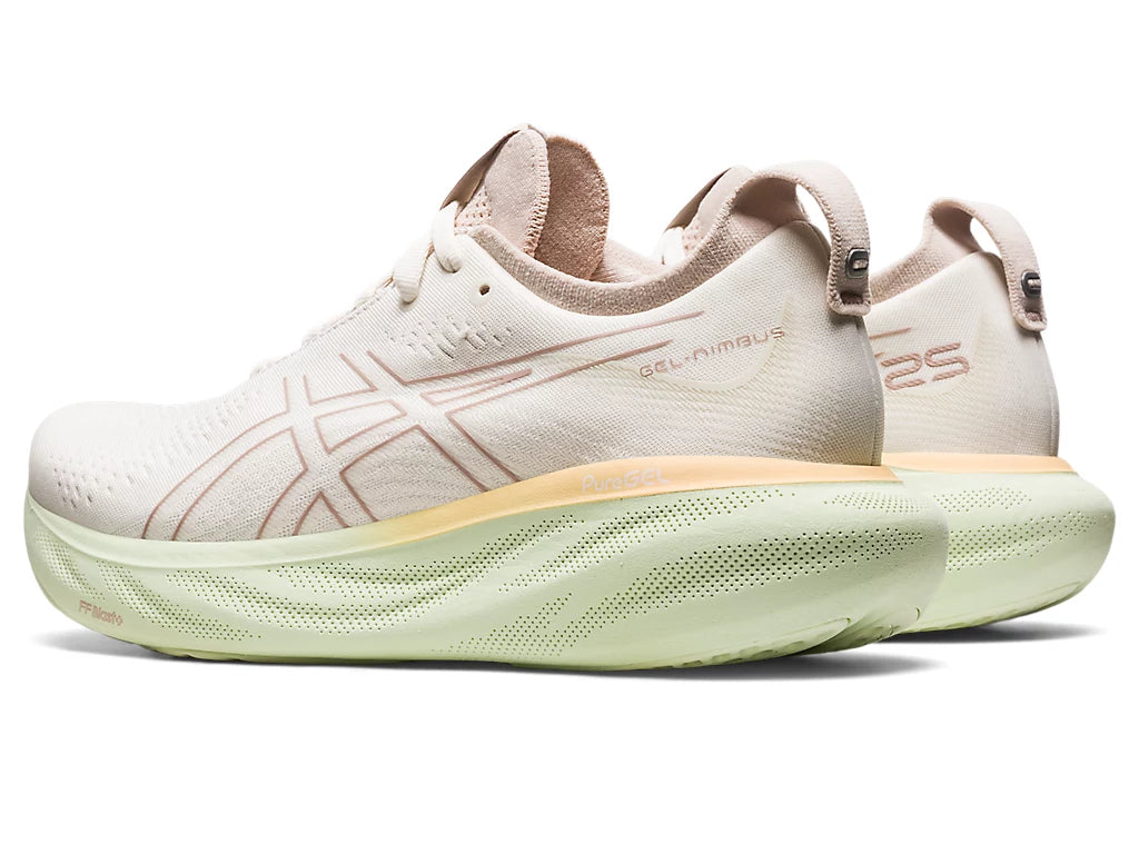 Back angled view of the Women's ASICS Nimbus 25 in the color Cream/Fawn