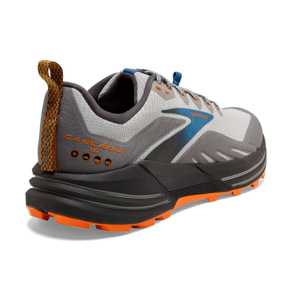 Back angled view of the Men's Cascadia 16 trail shoe by Brooks in the color Oyster
