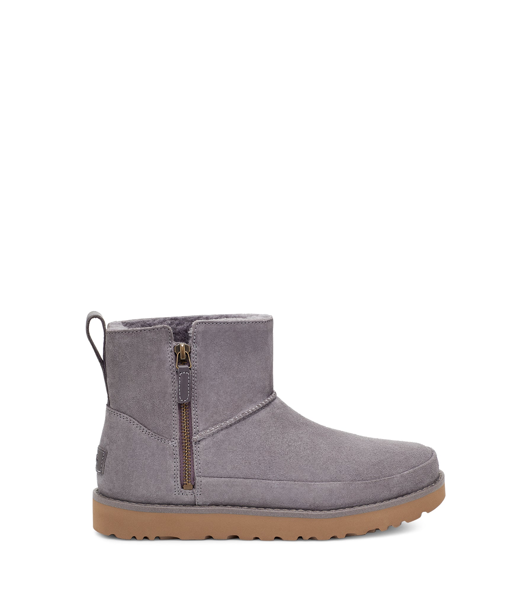 The Women's Classic has the same iconic look and feel as the traditional Classic.  Ugg has added a side-zip construction for easy on and off, plus a water-resistant suede upper to help preserve the rich character of the material. Lined in our famous sheepskin and luxurious UGGplus wool blend, the Women's Classic Zip Mini Boot incorporates a lightweight, cushioned sole for an ultra-soft step. Dress it up with trousers and cashmere, or go easy with jeans and a plaid flannel.