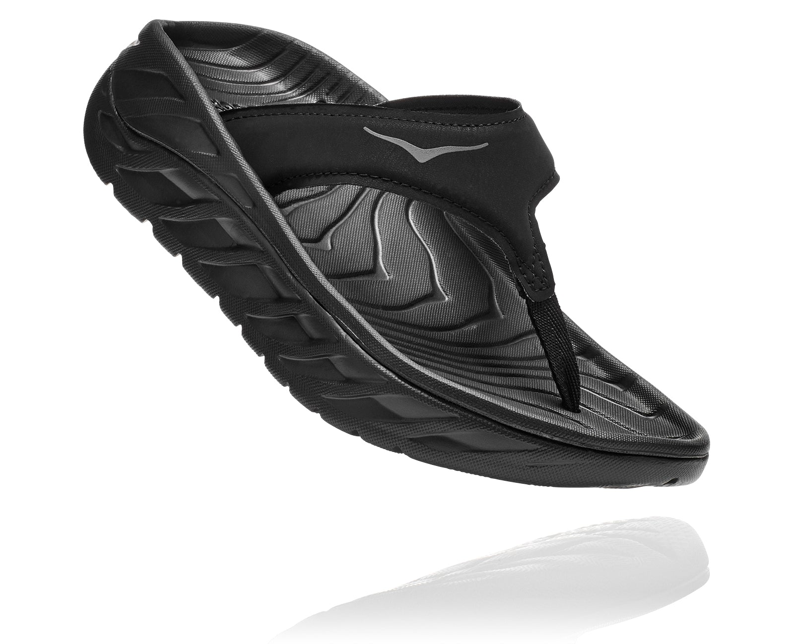 You just gave it all in that race and now your feet need some care, pronto. Enter the Women's ORA Recovery Flip. It features Hoka One One's oversized midsole and Meta-Rocker into a flip flop and improved the toe straps with a more anatomically friendly fit. It hugs the foot and provides sleek comfort and support. Your tired feet just got rescued. You’re welcome.