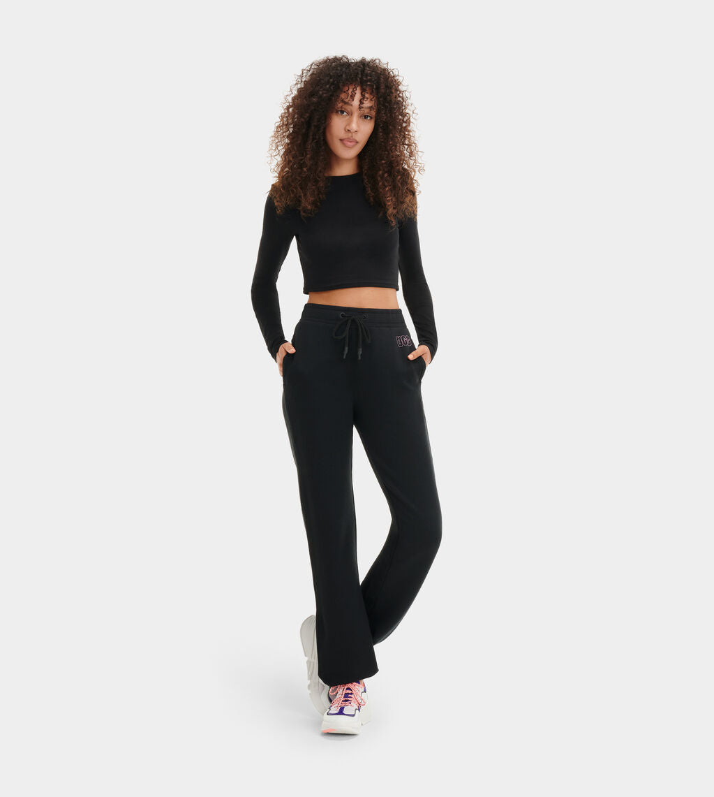 Made from 48% recycled cotton, the pant's two-sided brushed fleece offers fluffy softness inside and a clean, sweatshirt-like finish on the outside. Adding this versatile material to a lounge-worthy sweatpant, the Daniella features an easy elasticized waistband and cuffs, plus standout metallic embroidery. Perfect for sleep, errands, or just lounging around, you'll never want to take them off.