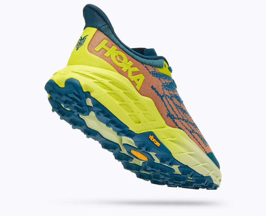 Back angled view of the Men's Speedgoat 5 trail shoe by HOKA in the wide "2E" width, color Blue Coral / Evening Primrose