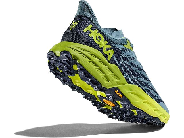Back angled view of the Men's Speedgoat 5 trail shoe by HOKA in the color Stone Blue / Dark Citron