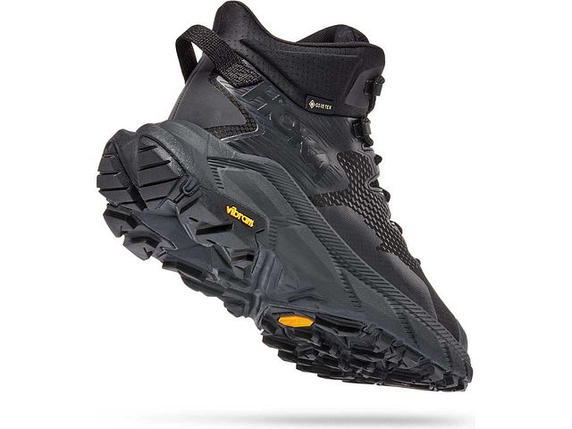 Back angled view of the Men's Trail Code GTX hiking boot from HOKA in the color Black / Raven