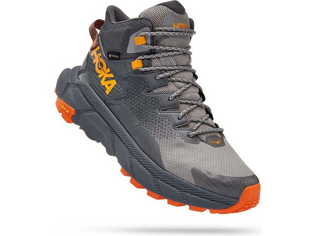 Lateral angled view of the Men's Trail Code GTX hiking boot by HOKA in the color Castlerock/Persimmon Orange