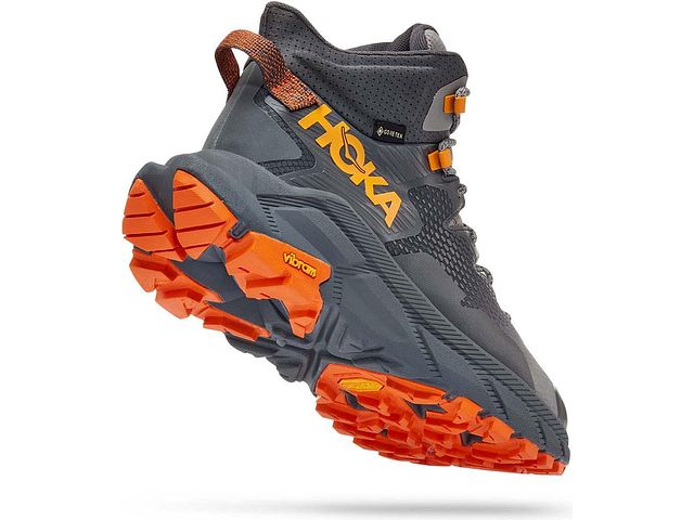 Back angled view of the Men's Trail Code GTX hiking boot by HOKA in the color Castlerock/Persimmon Orange