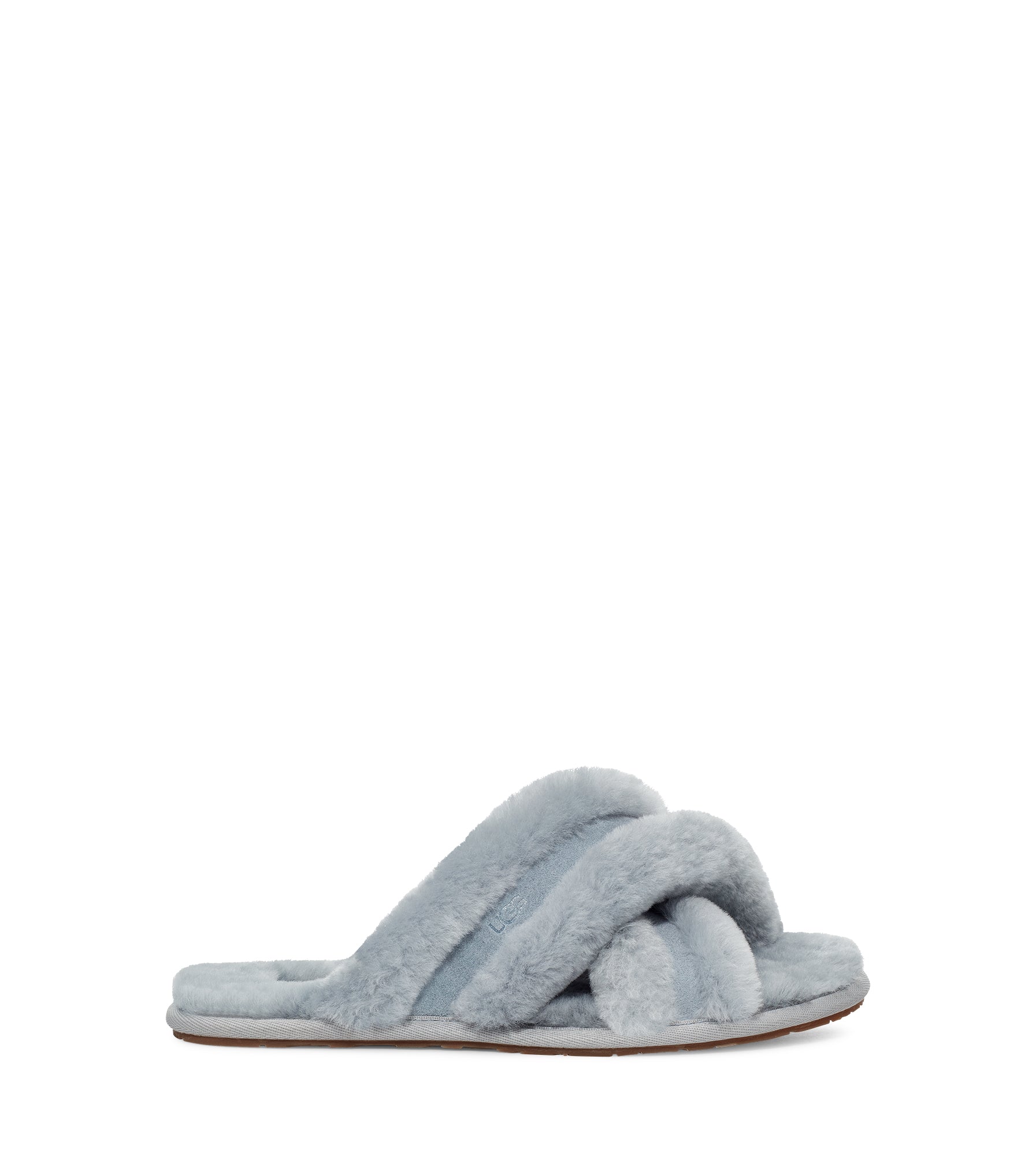 The Women's Ugg Scuffita is a house slipper featuring the same soft sheepskin and a molded rubber outsole of the well know Scuffette. This updated version features fluffy cross-straps and rich suede overlays, it pairs perfectly with robes and loungewear for weekend relaxation.