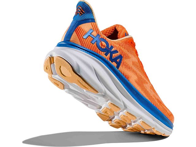 Back angled view of the Men's HOKA Clifton 9 in the wide "2E" width, color Vibrant Orange/Impala