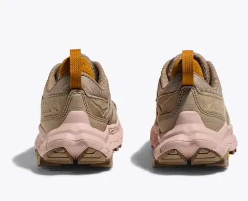Back view of the Women's HOKA Anacapa Breeze Low trail shoe in the color Oxford Tan / Peach Whip
