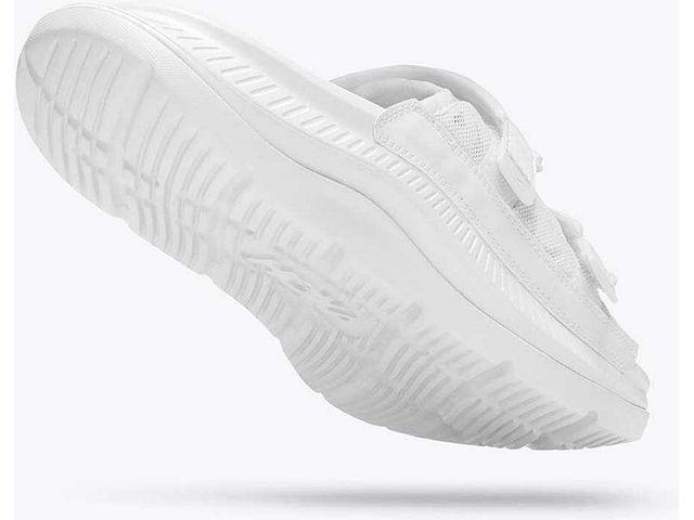 Back angled view of the Unisex Ora Luxe Recovery Slide by HOKA in the color white