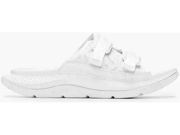 Lateral view of the Unisex Ora Luxe Recovery Slide by HOKA in the color white