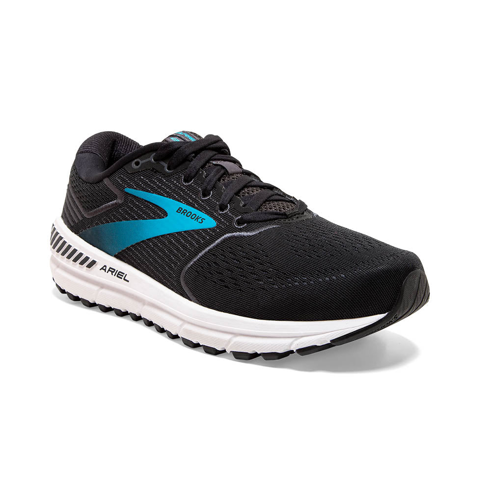 The diagonal angle of the Brooks Ariel shoes the teal colored Brooks logo on the medial side 