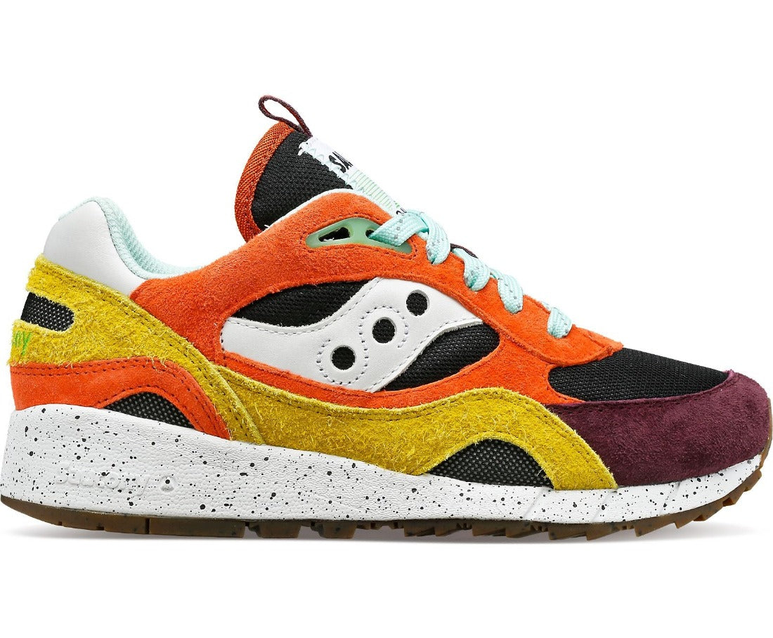 Lateral view of the Saucony Shadow 6000 Trailian (Unisex sizing) in the color Coral / Mustard