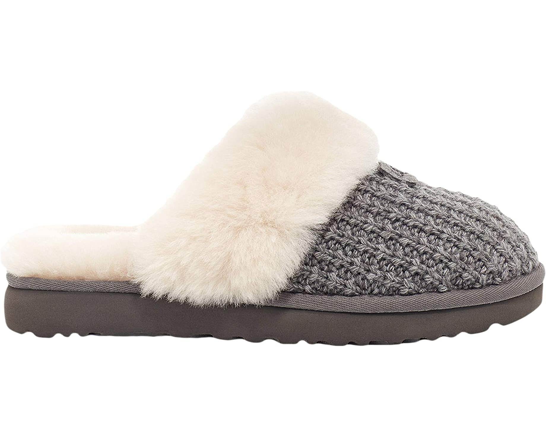 A soft, sweater-knit upper and lush sheepskin lining add softness and style to this outdoor-friendly slipper. Featuring a fluffy collar and super-light, durable sole, it slips on with Saturday sweats, faded denim, or your favorite knit pieces.