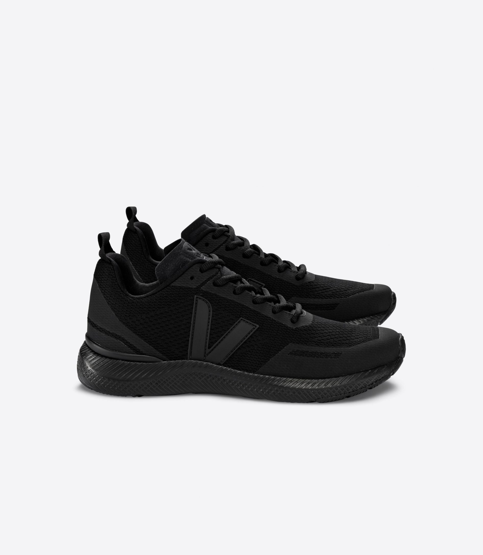 Lateral view of a pair of Women's Impala's by VEJA in all black