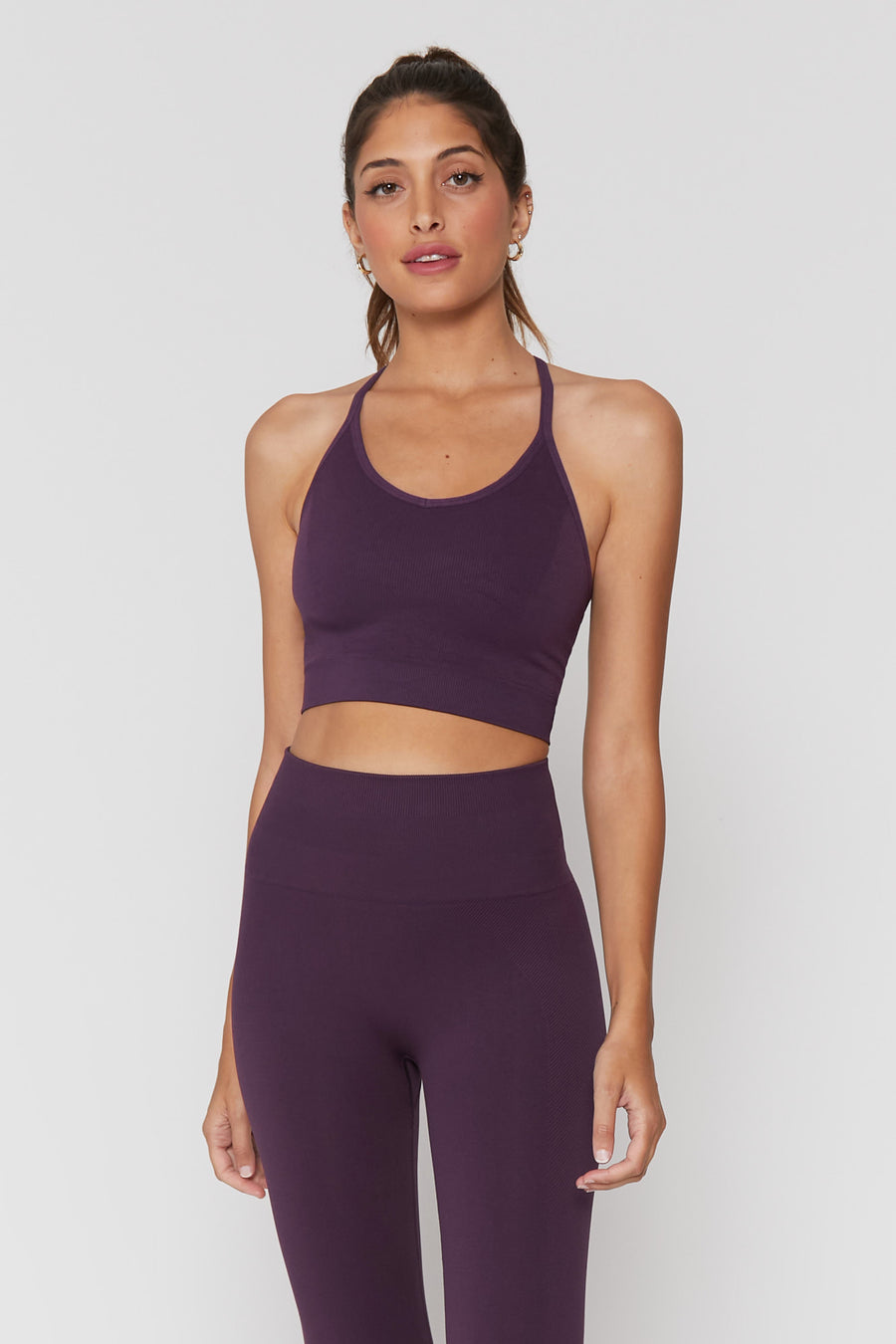 Own your icon status in this seamless Icon T-Back Sports Bra from Spiritual Gangster, and get the support you deserve.