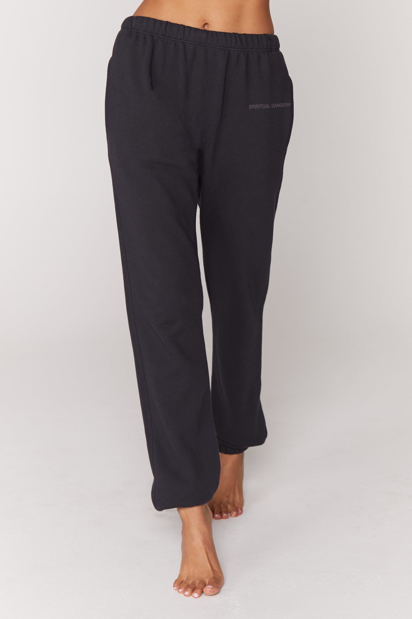 Women's SG Laguna Sweatpant in BlackYou were born to lounge. Full length means full comfort in our super soft and easy to wear SG Laguna Sweatpant. Made with 100% cotton, a slouchy and relaxed oversized fit for maximum comfort, elastic waistline and ankles, and "Spiritual Gangster" front logo. Perfect to throw on after a sweat session or for casual days. 