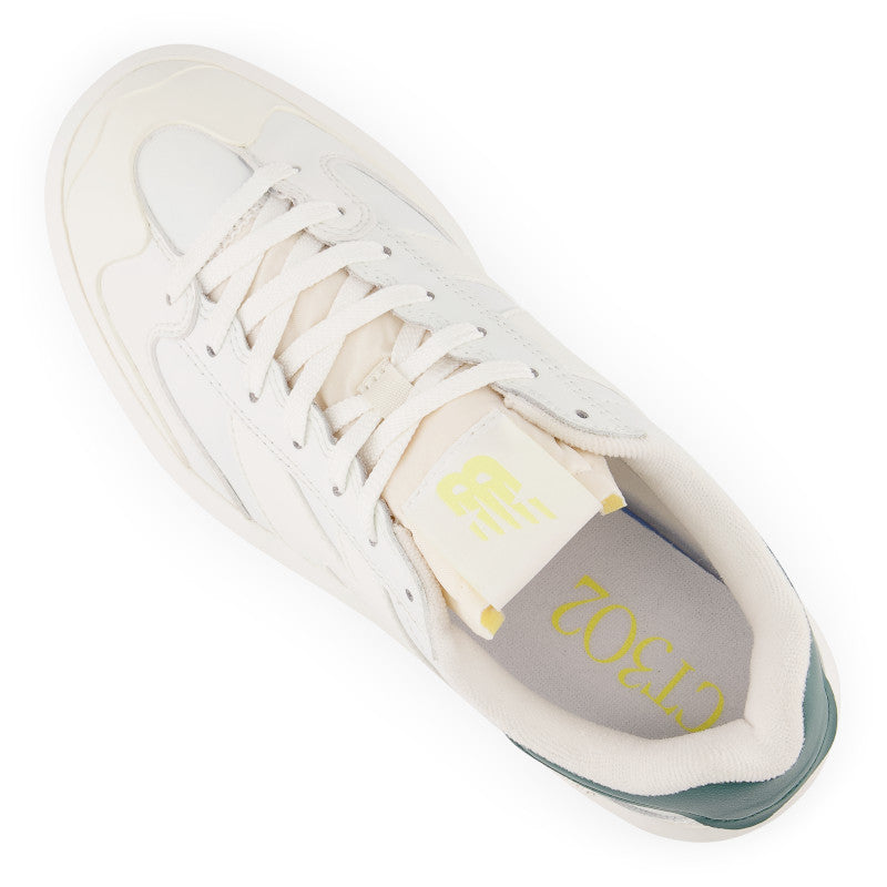 Angled top view of the Unisex New Balance CT302 Lifestyle shoe in the color White with vintage teal and maize