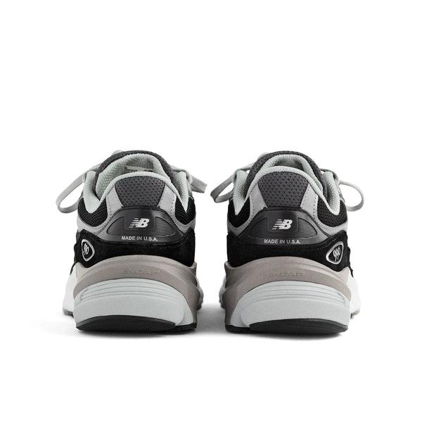 Back view of the Men's New Balance 990 V6 lifestyle shoe in the color Black/White