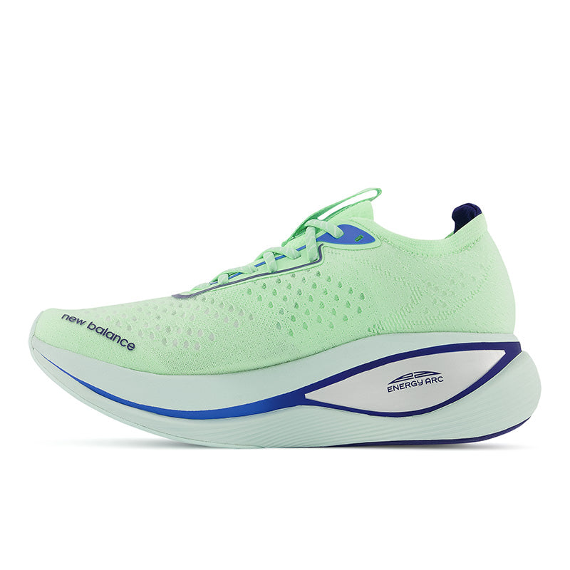 Medial view of the Men's Fuel Cell SuperComp Trainer by New Balance in the color Vibrant Spring Glo/Victory Blue