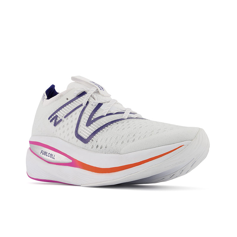Front angle view of the Men's Fuel Cell SuperComp Trainer by New Balance in the color White/Victory Blue/Magenta Pop