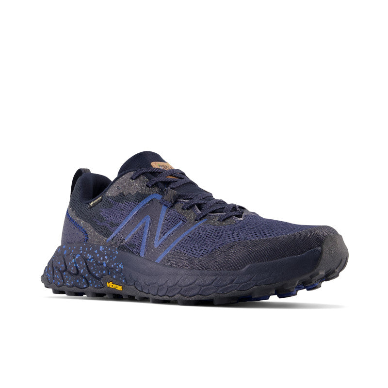 Front angle view of the Men's Hierro V7 Gortex trail shoe by New Balance in the color Eclipse/Natural Indigo
