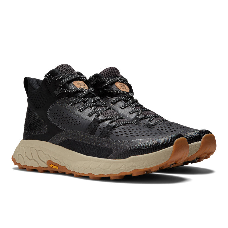 Front angled view of the Men's New Balance Fresh Foam X Hierro Mid trail shoe in Black