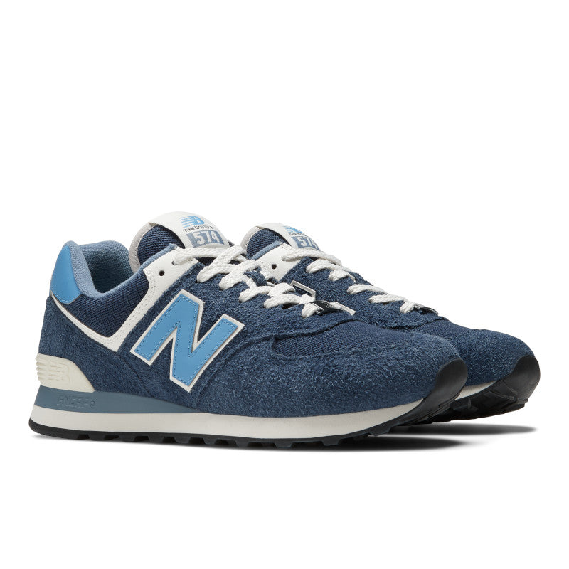 Front angle view of the Men's New Balance 574 Lifestyle shoe in Navy/Blue