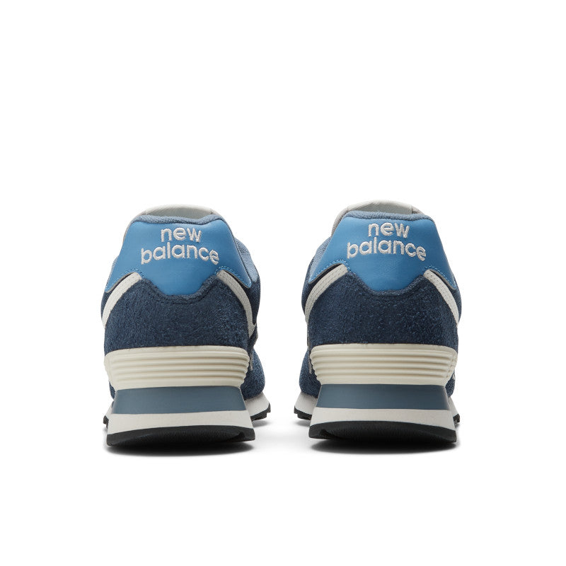 Back view of the Men's New Balance 574 Lifestyle shoe in Navy/Blue