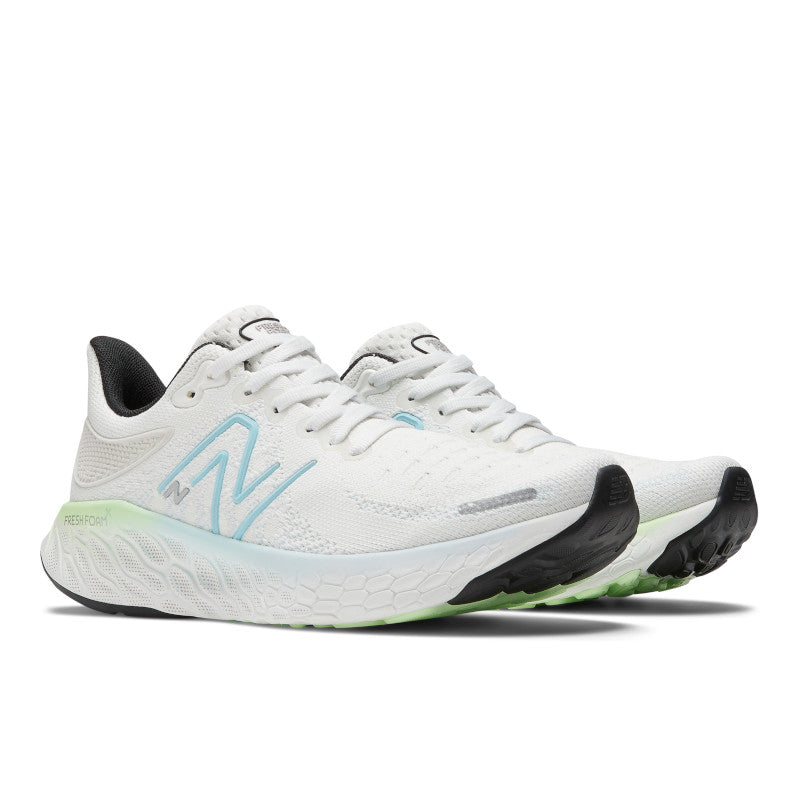 Front angle view of the Women's New Balance 1080 V12 in the color White/Bleach Blue/Green Aura