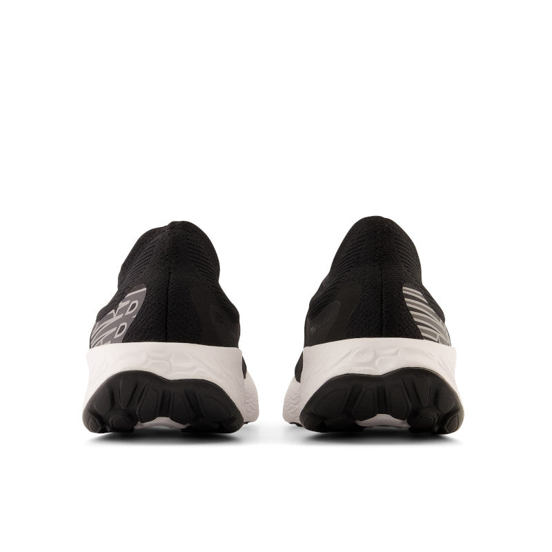 Back view of the Women's New Balance 1080 Unlaced in Black/White