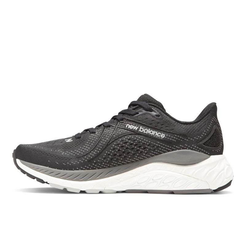 Medial view of the Women's New Balance 860 V13 in the color Black/White/Castlerock