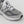 The New Balance 990’s original designers were tasked with creating the single best running shoe on the market. The finished product more than lived up to its billing. When it hit shelves for the first time in 1982 the 990 sported an elegantly understated grey colorway, and a then unheard of three-figure price tag. For avid runners and ahead of the curve tastemakers alike, the 990 was a mark of quality and superior taste. 