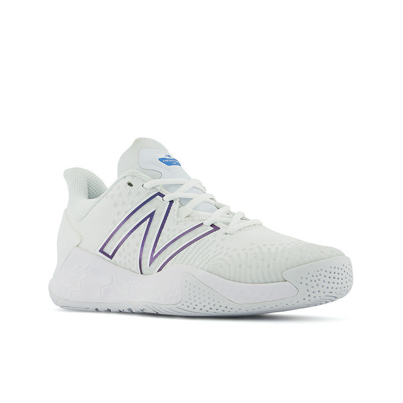 The diagonal view of this women's New Balance Tennis shoe shows the midsole that comes up high on the side to provide extra stability