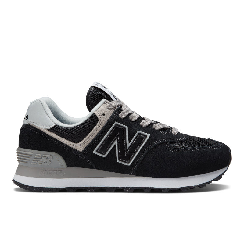 Lateral view of the Women's New Balance 574 lifestyle shoe in Black/White