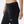 Zoomed in side  view of the NB Women's Impact Run Legging in Black