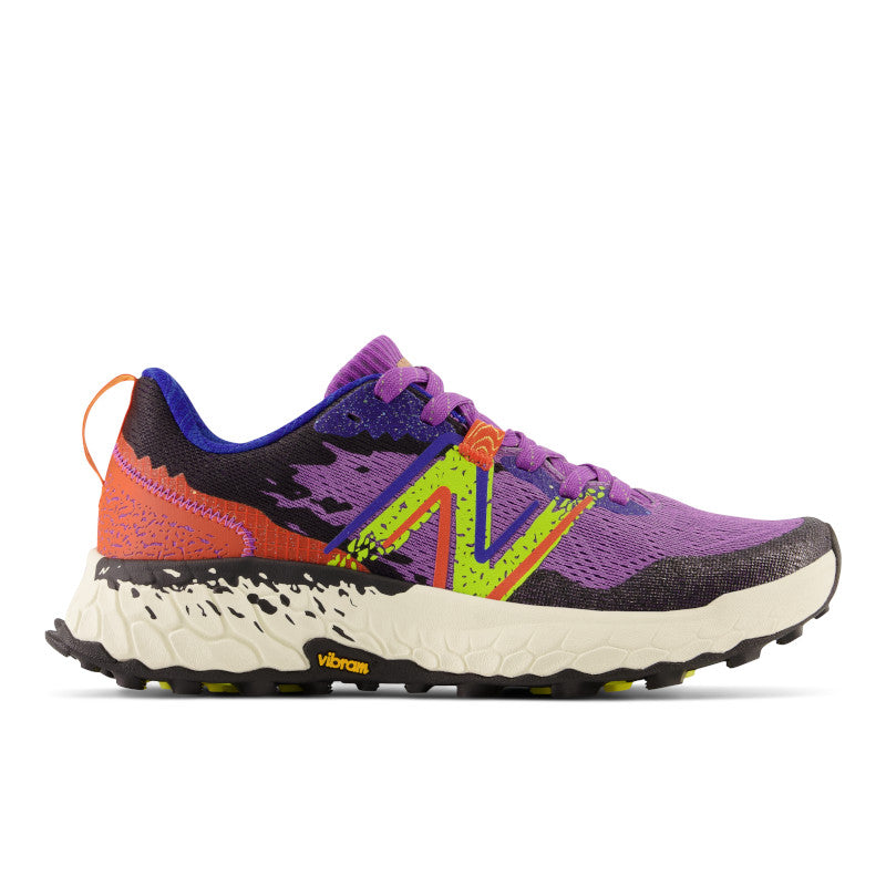 Lateral view of the Women's Trail Hierro V7 by New Balance in the color Mystic Purple / Poppy