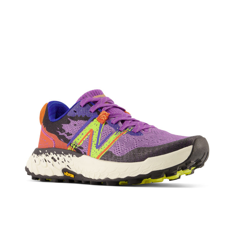 Front angled view of the Women's Trail Hierro V7 by New Balance in the color Mystic Purple / Poppy