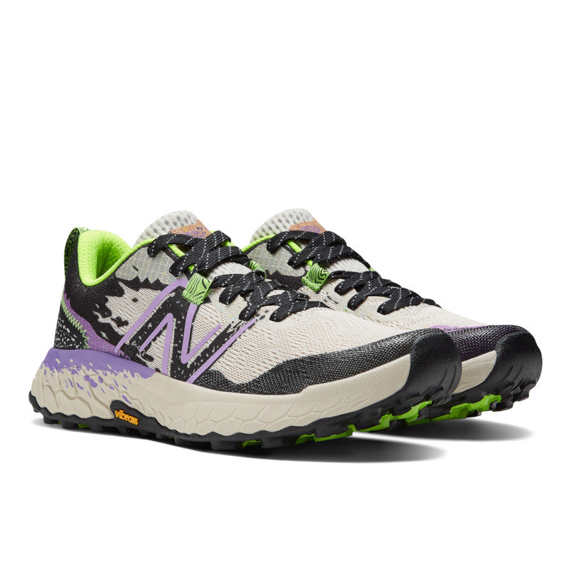 Front angle view of the Women's Hierro V7 trail shoe by New Balance in the color Moonbeam