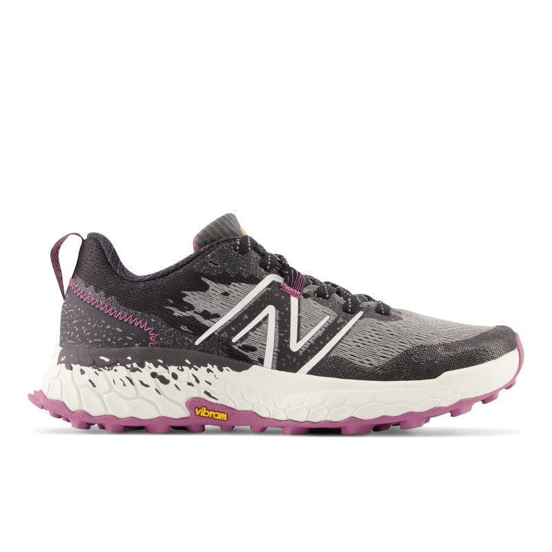 Lateral view of the Women's Hierro V7 Trail shoe by New Balance in the color Castlerock with raisin