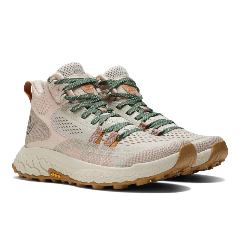 Front angle view of the Women's Fresh Foam X Hierro Mid trail shoe by New Balance in the color Timberwolf / Dusted Clay